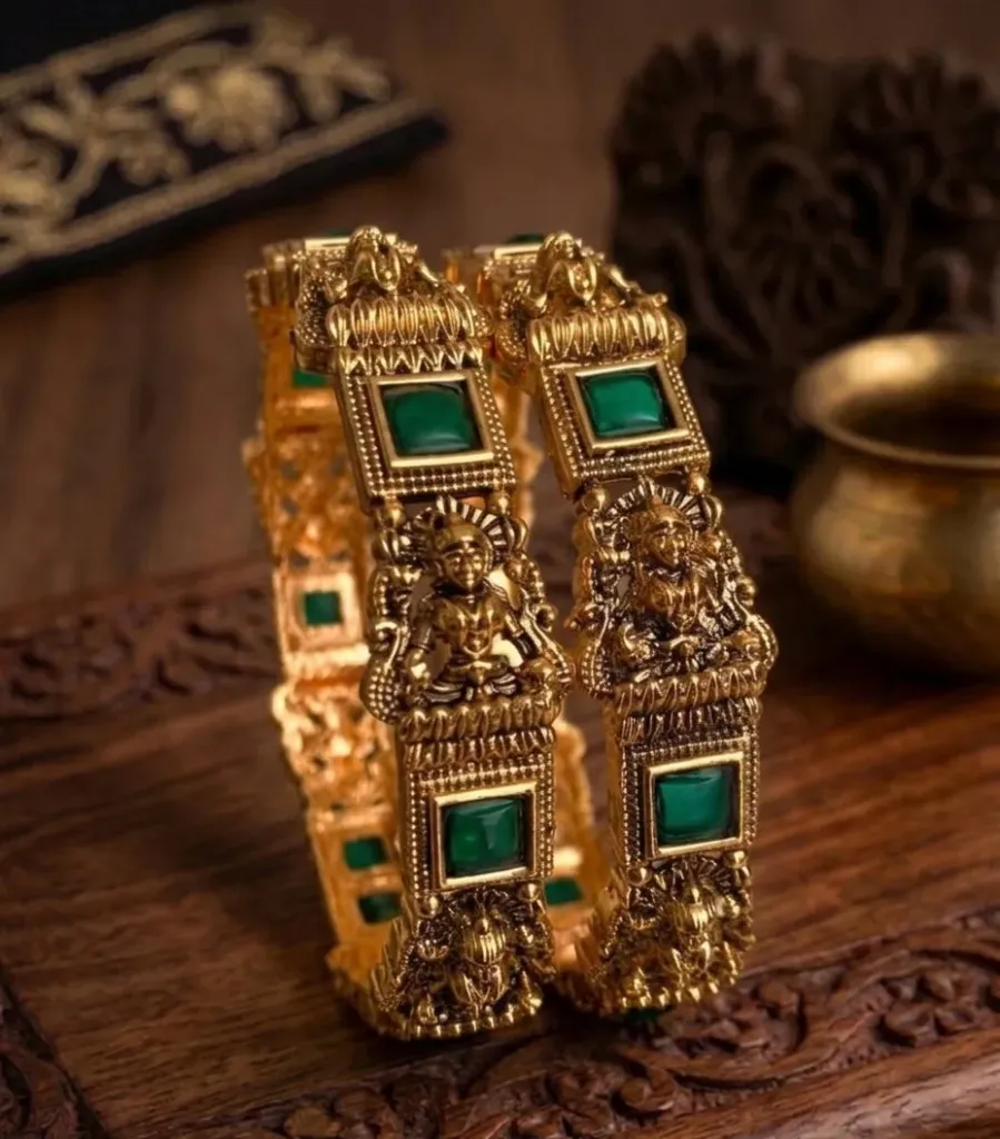 Golden heritage meets emerald radiance in this divine bangles.