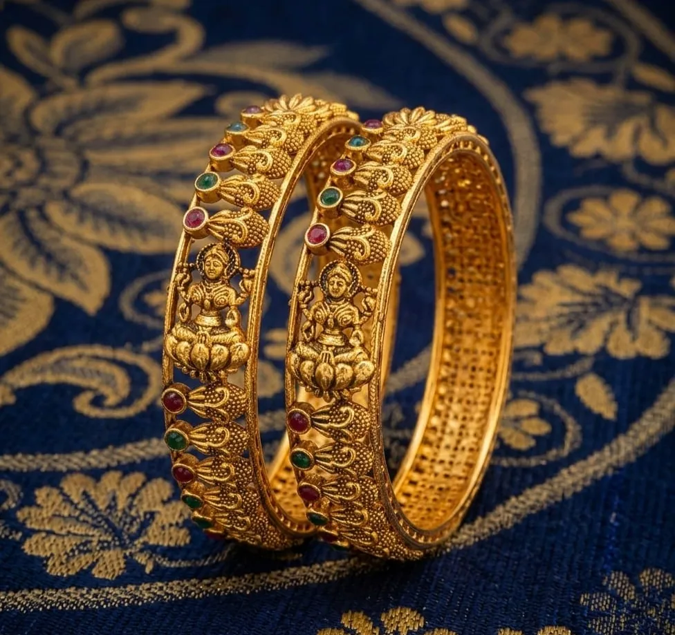 Stunning Gold-toned adorned with intricate goddess motifs and sparkling ruby & emerald gemstone, perfect for adding regal elegance to any traditional outfits.