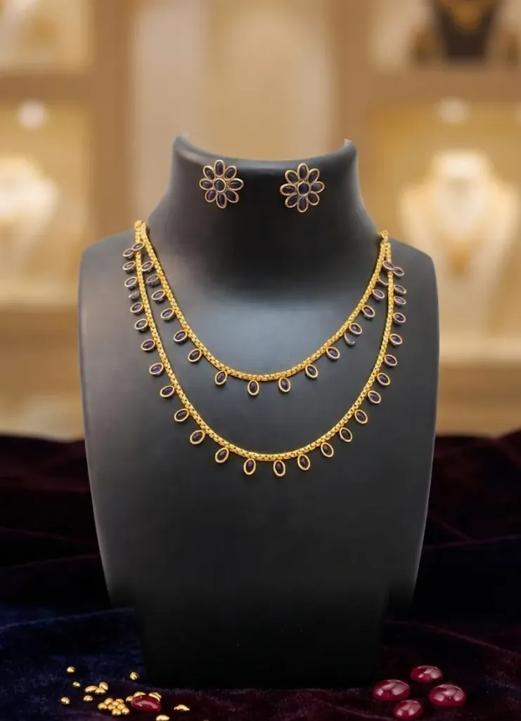 Gorgeous double-layer necklace with delicate blue gemstones ovals, teamed with matching flower design earrings that add a luxe, regal touch to any outfit.