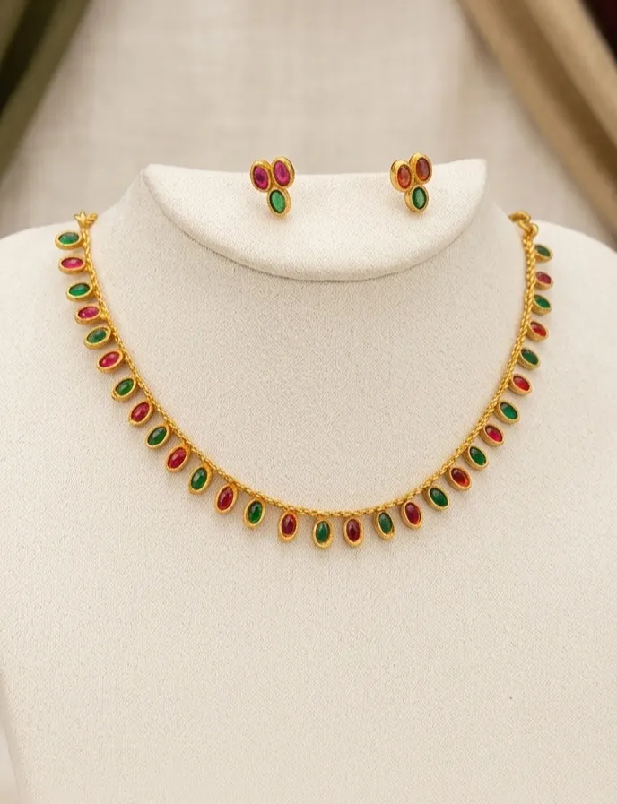 Add a burst of elegance to your celebration with our stunning necklace and earrings featuring stinking ruby-pink and emerald - green stones, this set blends tradition with modern charm.