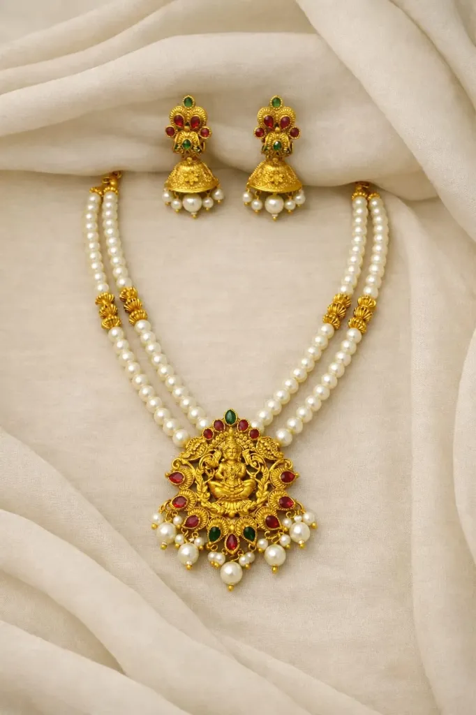 Grace in every detail-this temple-inspired pearl short haram and jhumka set radiant tradition and elegance.
