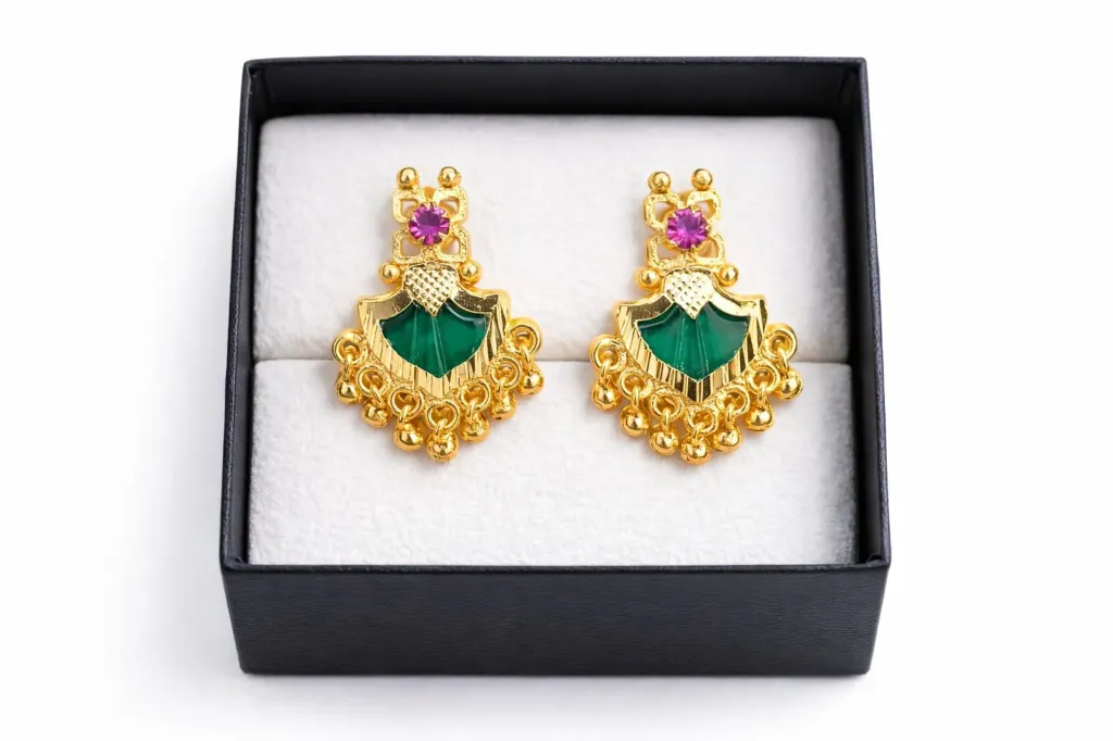 Wear regal confidence-gold-plated earrings with pink & emerald gemstone accents.
