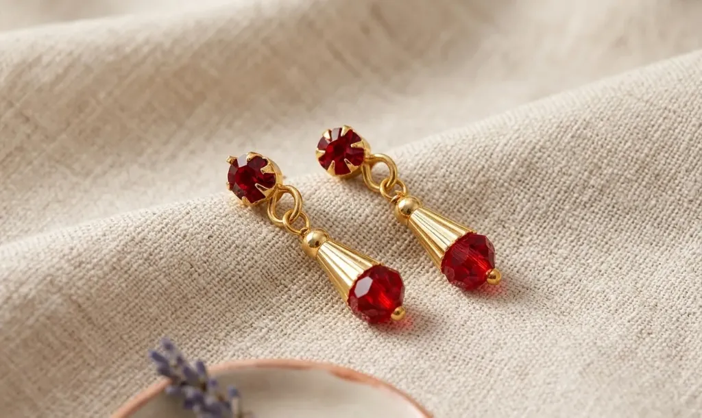 Charming elegance, ruby sparkle-let this luxurious drop earrings steal the spotlight and make every moment shine like precious jewellery adorned with timeless allure.