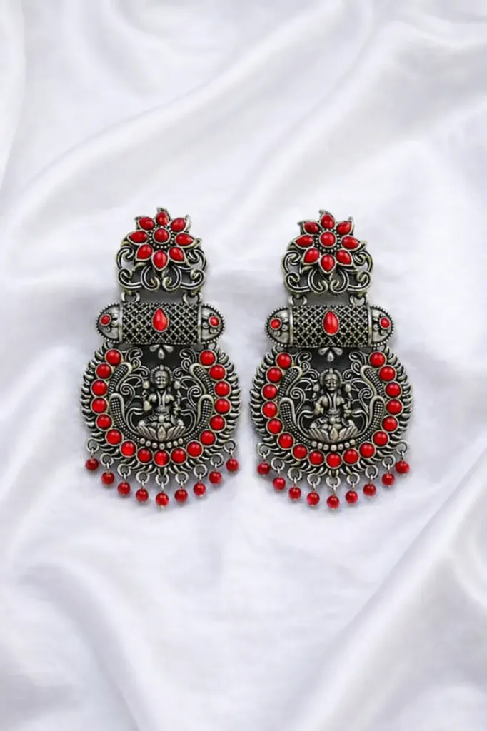 Add a touch of elegance to your look with these stunning silver earrings. (red)