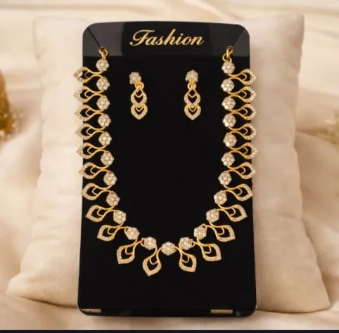 Fashion jewelry set featuring leaf motifs and sparkling stones.