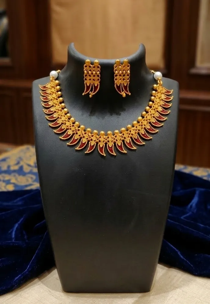 Where craftmanship meets culture-a radiant paring of necklace and earrings for the modern connoisseur.